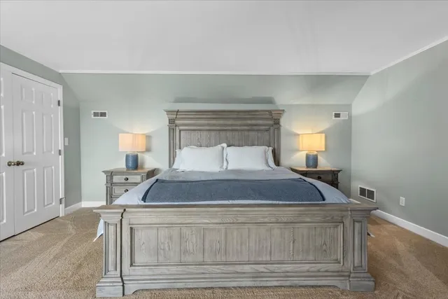 a bedroom with a bed and window