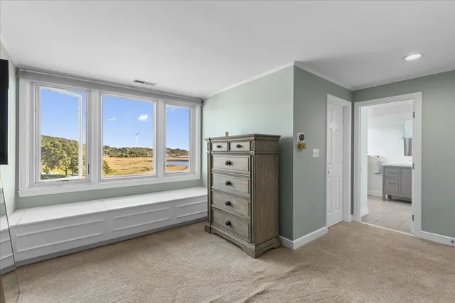 a view of a livingroom with furniture and windows
