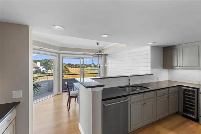 a kitchen with a sink and cabinets