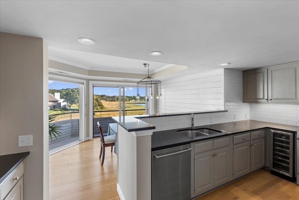 29 Ladds Way, Unit 29 Scituate, MA 02066 - Photo 3 of 33 a kitchen with a sink and cabinets