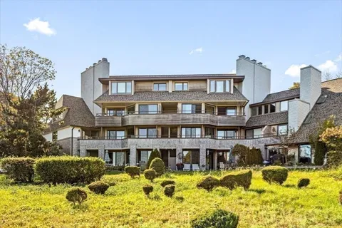 a front view of a building with a swimming pool