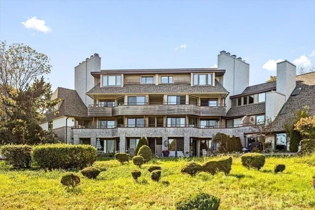 a front view of a building with a swimming pool
