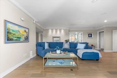 a living room with furniture and a rug