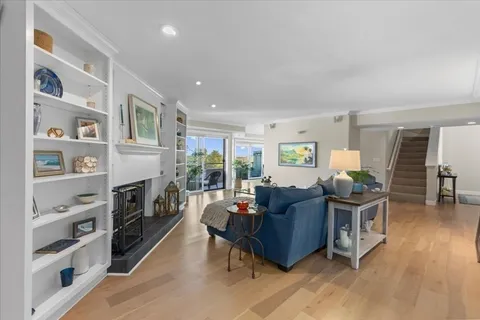a living room with furniture flat screen tv and a fireplace