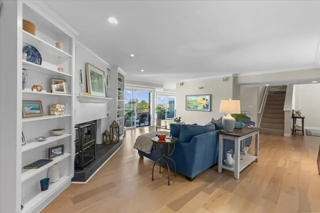 a living room with furniture flat screen tv and a fireplace