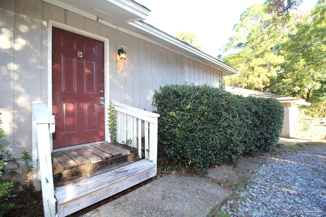 a view of a house with a small yard