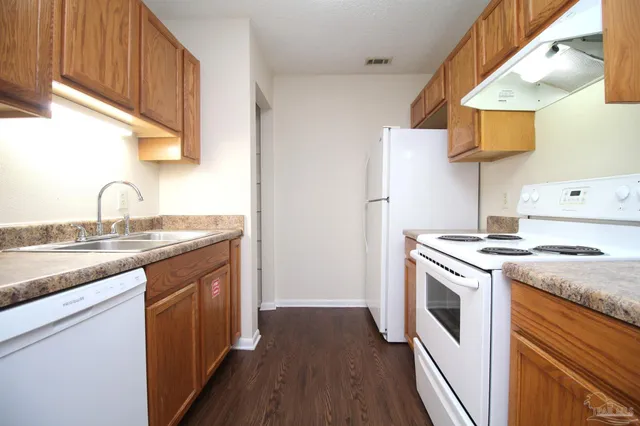 a kitchen with a stove and a sink