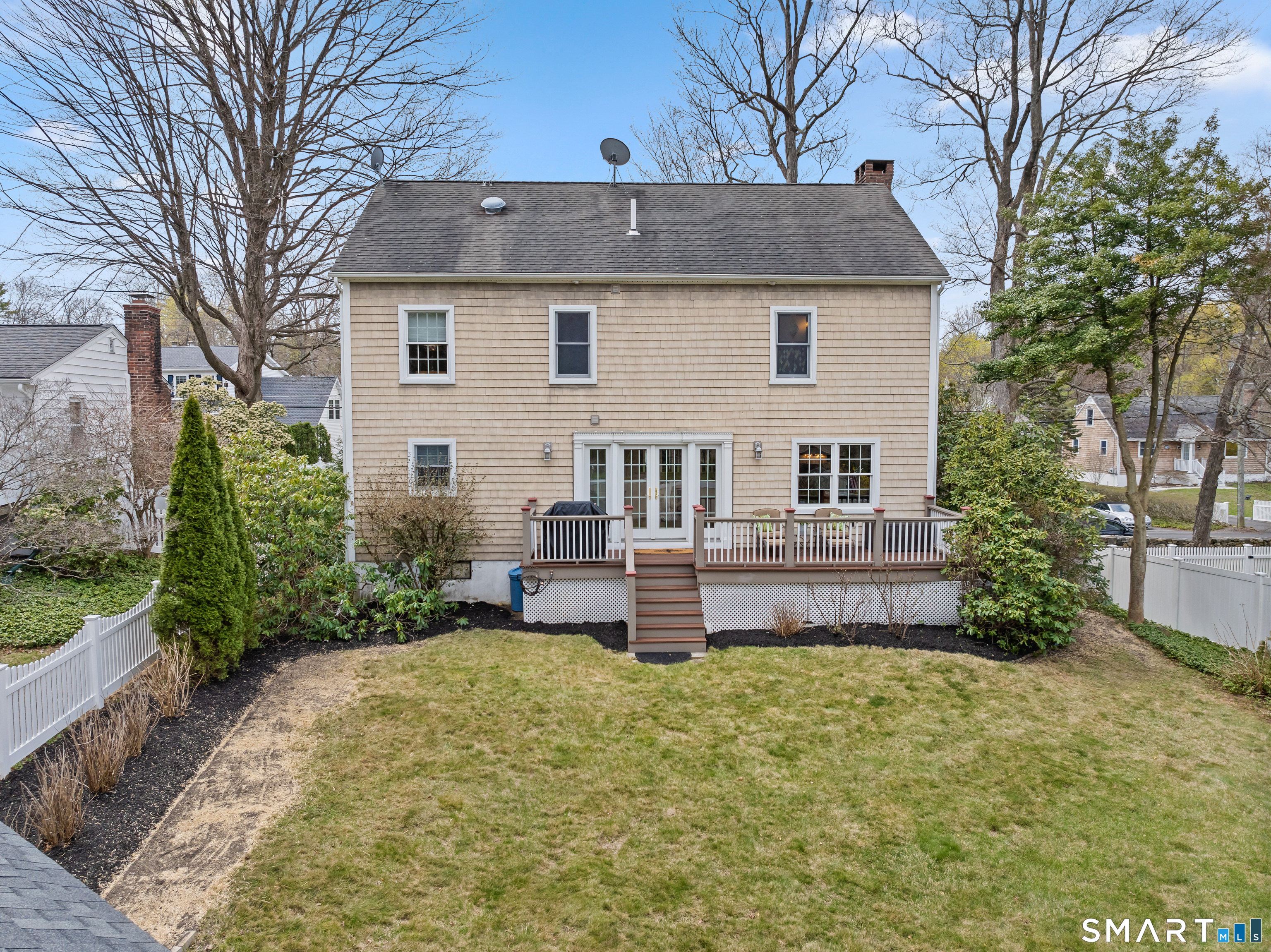 82 Ramapoo Road Ridgefield, CT 06877 - Photo 4 of 40 a front view of a house with a garden and plants