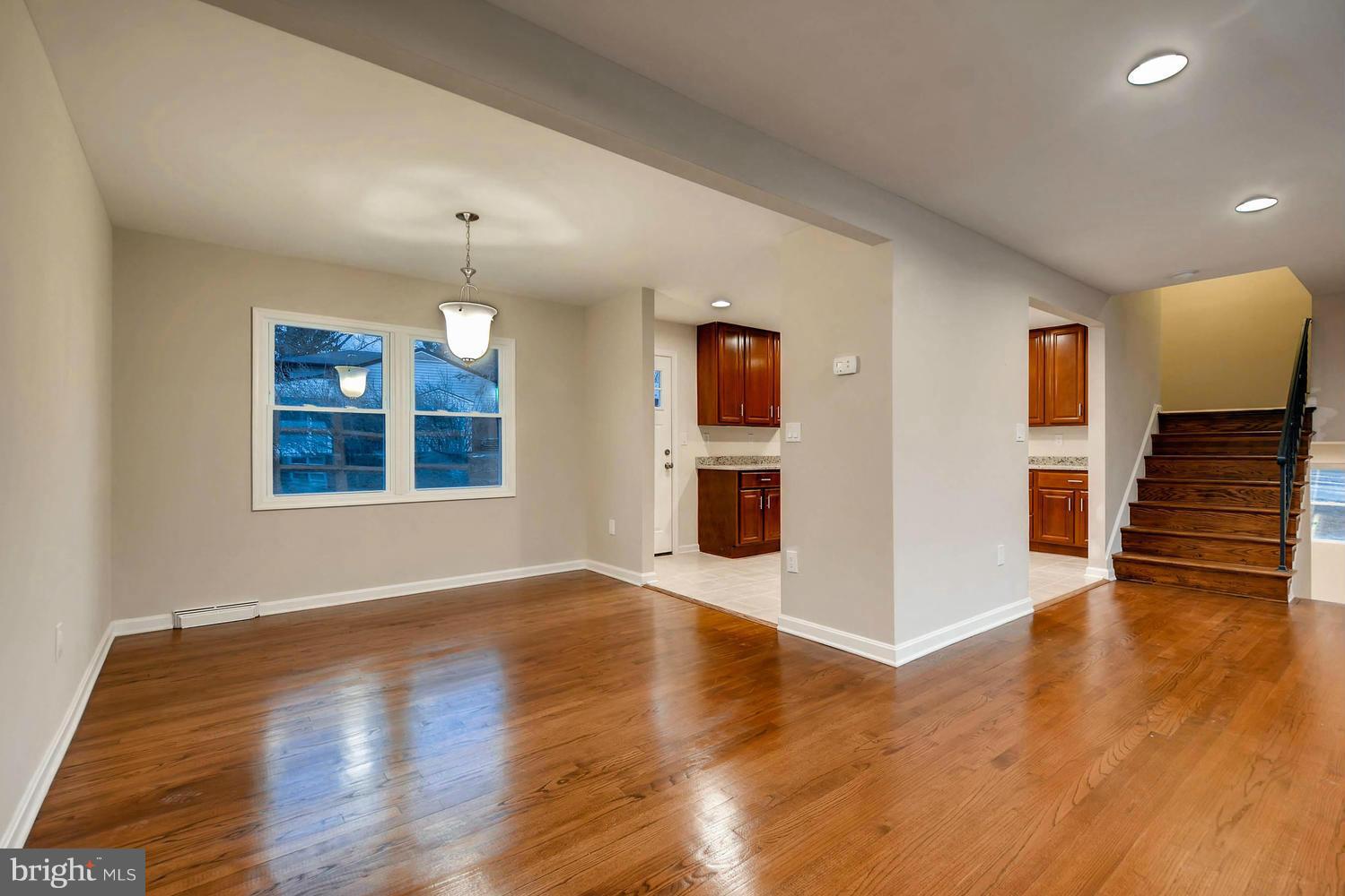 4515 Tapscott Road Pikesville, MD 21208 - Photo 11 of 28 a view of an empty room with wooden floor and a window