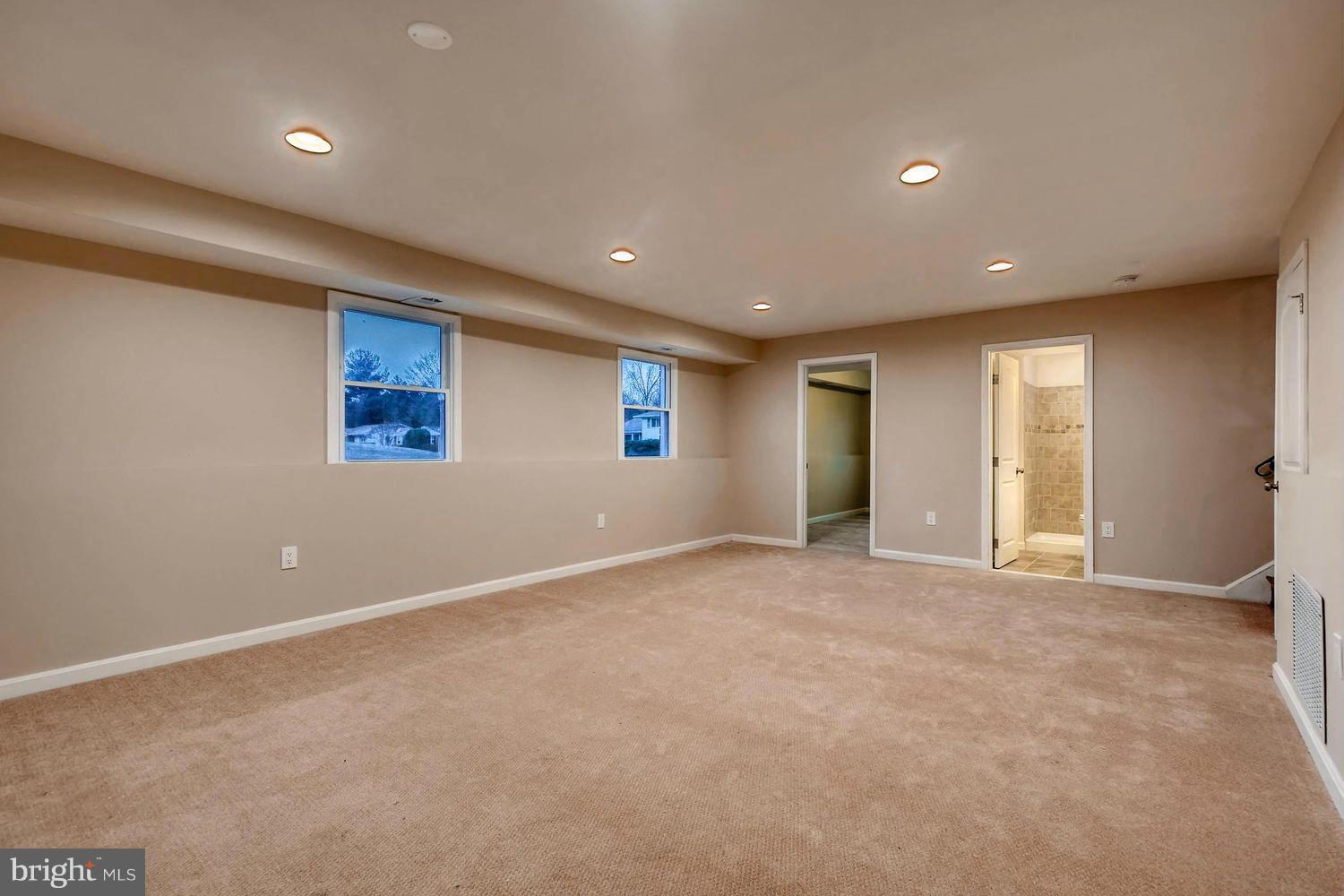 4515 Tapscott Road Pikesville, MD 21208 - Photo 21 of 28 a view of an empty room with window and closet area
