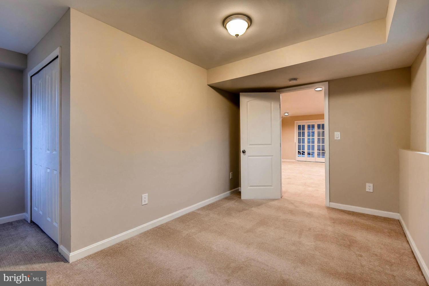 4515 Tapscott Road Pikesville, MD 21208 - Photo 22 of 28 an empty room with windows