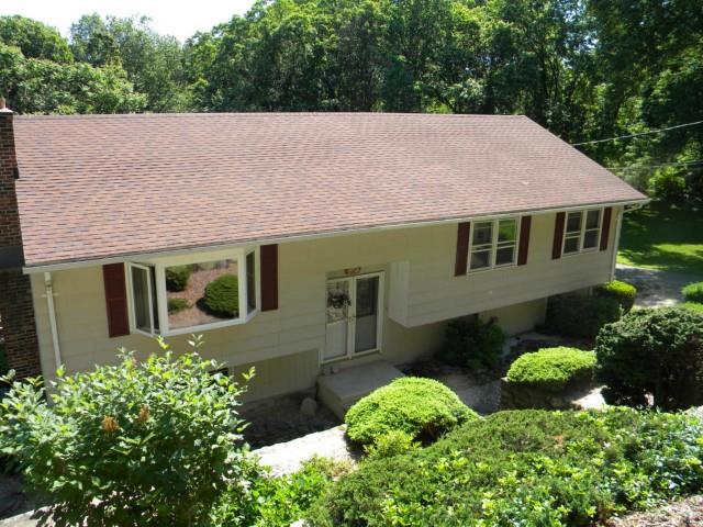 121 Coram Road Shelton, CT 06484 - Photo 1 of 1 a aerial view of a house with a yard and potted plants