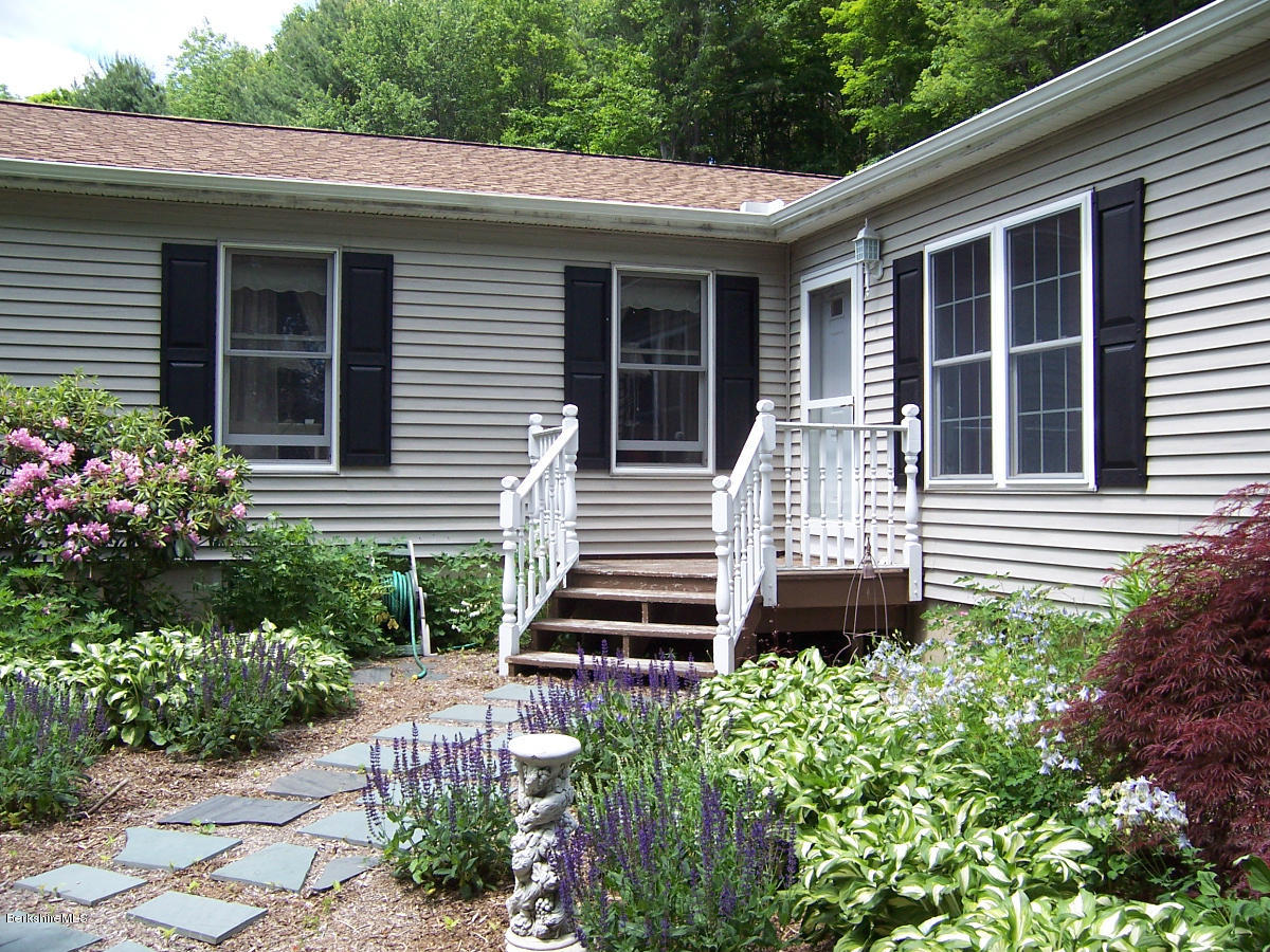 44 Stonehouse Road Washington, MA 01223 - Photo 12 of 56 a front view of a house with potted plants