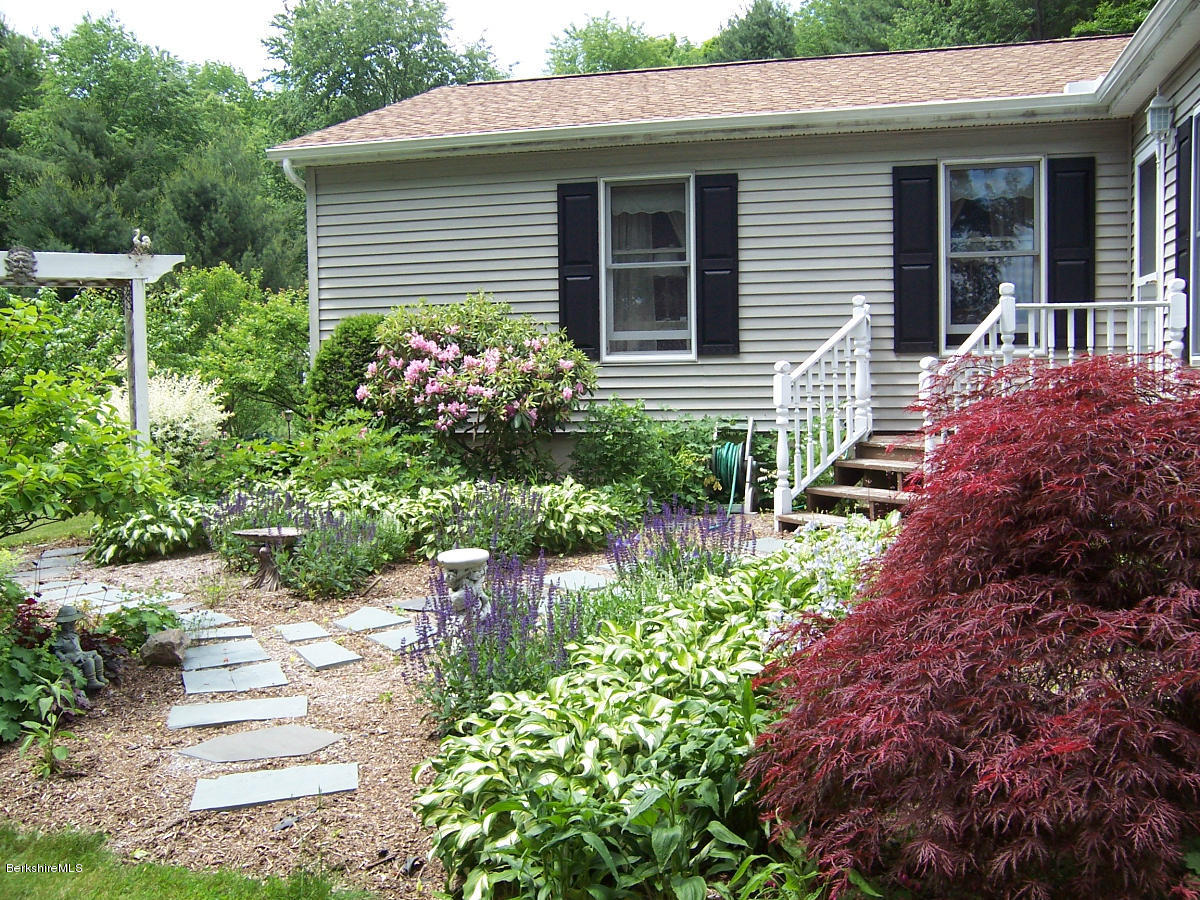 44 Stonehouse Road Washington, MA 01223 - Photo 13 of 56 a view of a house with a yard and sitting area