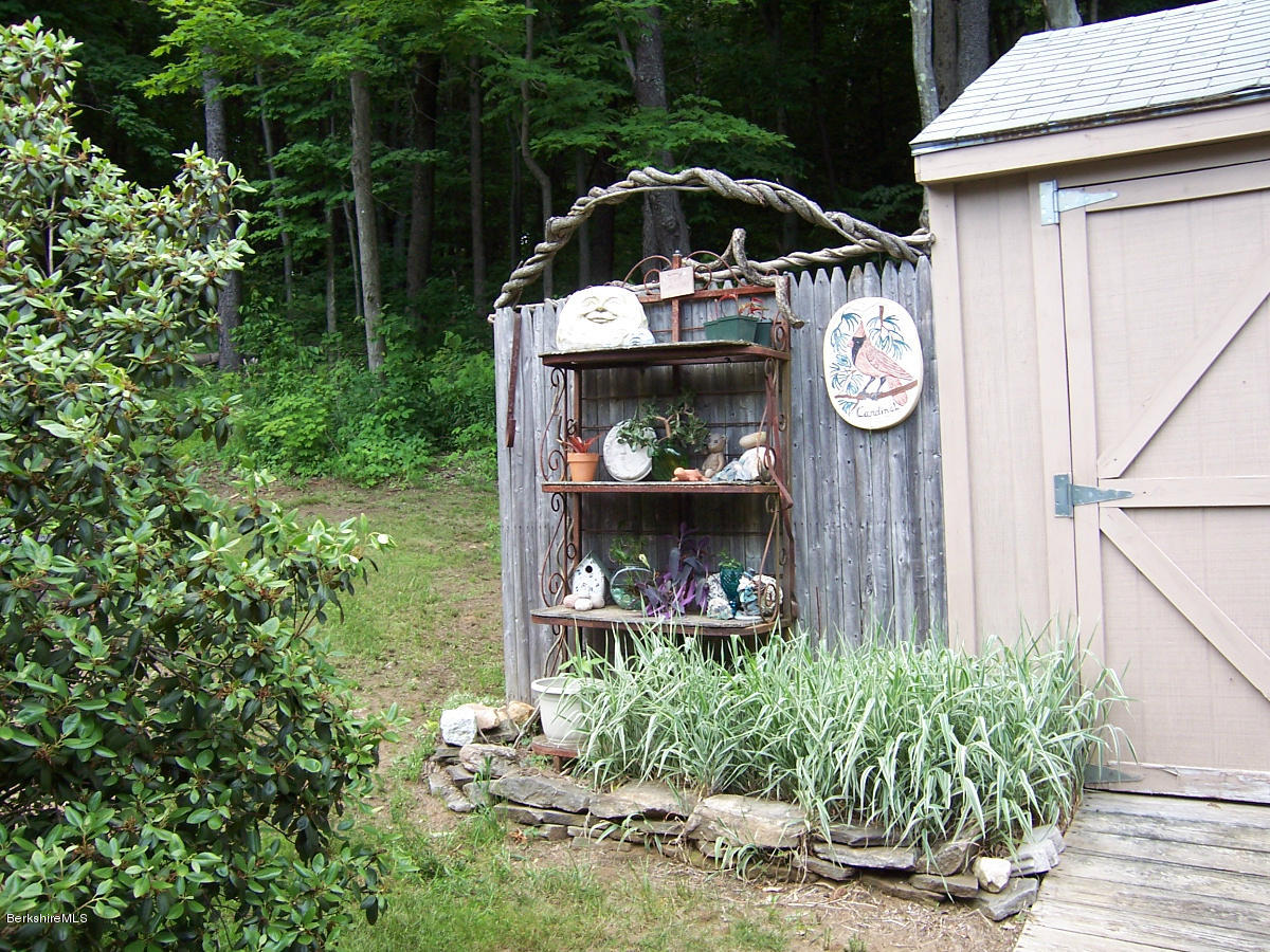 44 Stonehouse Road Washington, MA 01223 - Photo 14 of 56 a front view of a house with garden