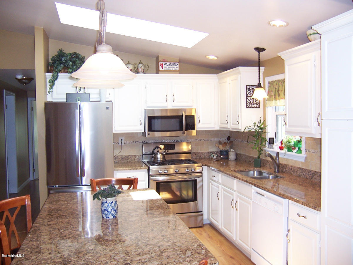 44 Stonehouse Road Washington, MA 01223 - Photo 29 of 56 a kitchen with stainless steel appliances a sink stove and refrigerator