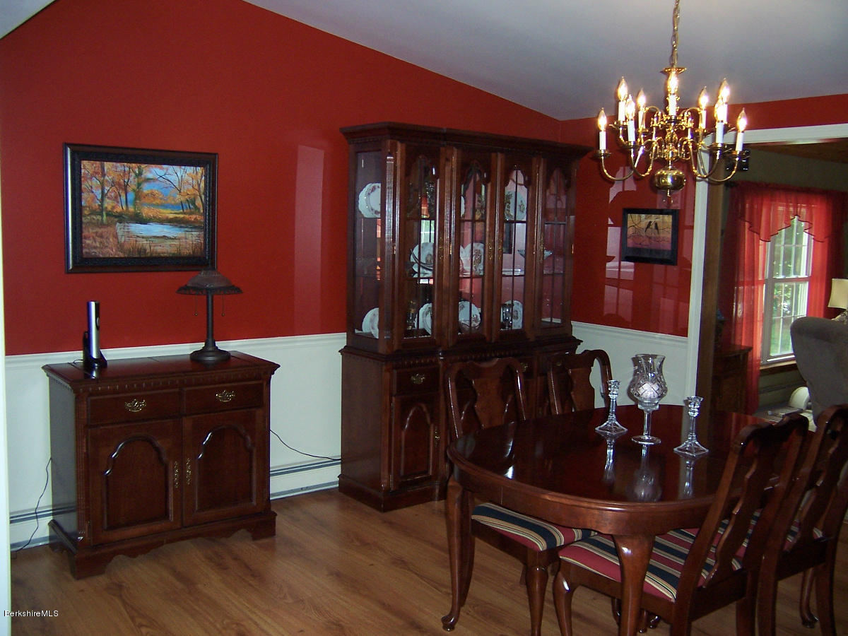 44 Stonehouse Road Washington, MA 01223 - Photo 34 of 56 a view of a dining room with furniture and chandelier