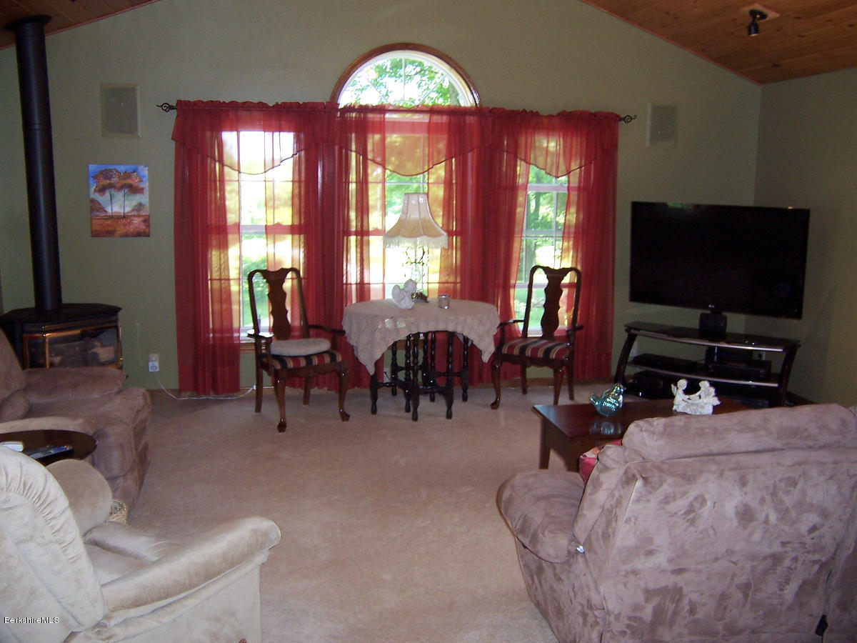 44 Stonehouse Road Washington, MA 01223 - Photo 42 of 56 a living room with furniture and a flat screen tv