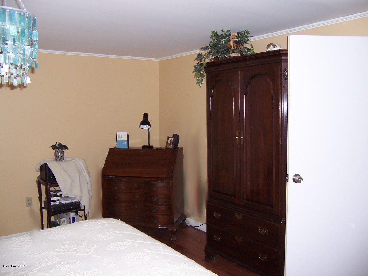 44 Stonehouse Road Washington, MA 01223 - Photo 46 of 56 a bedroom with a bed and a mirror