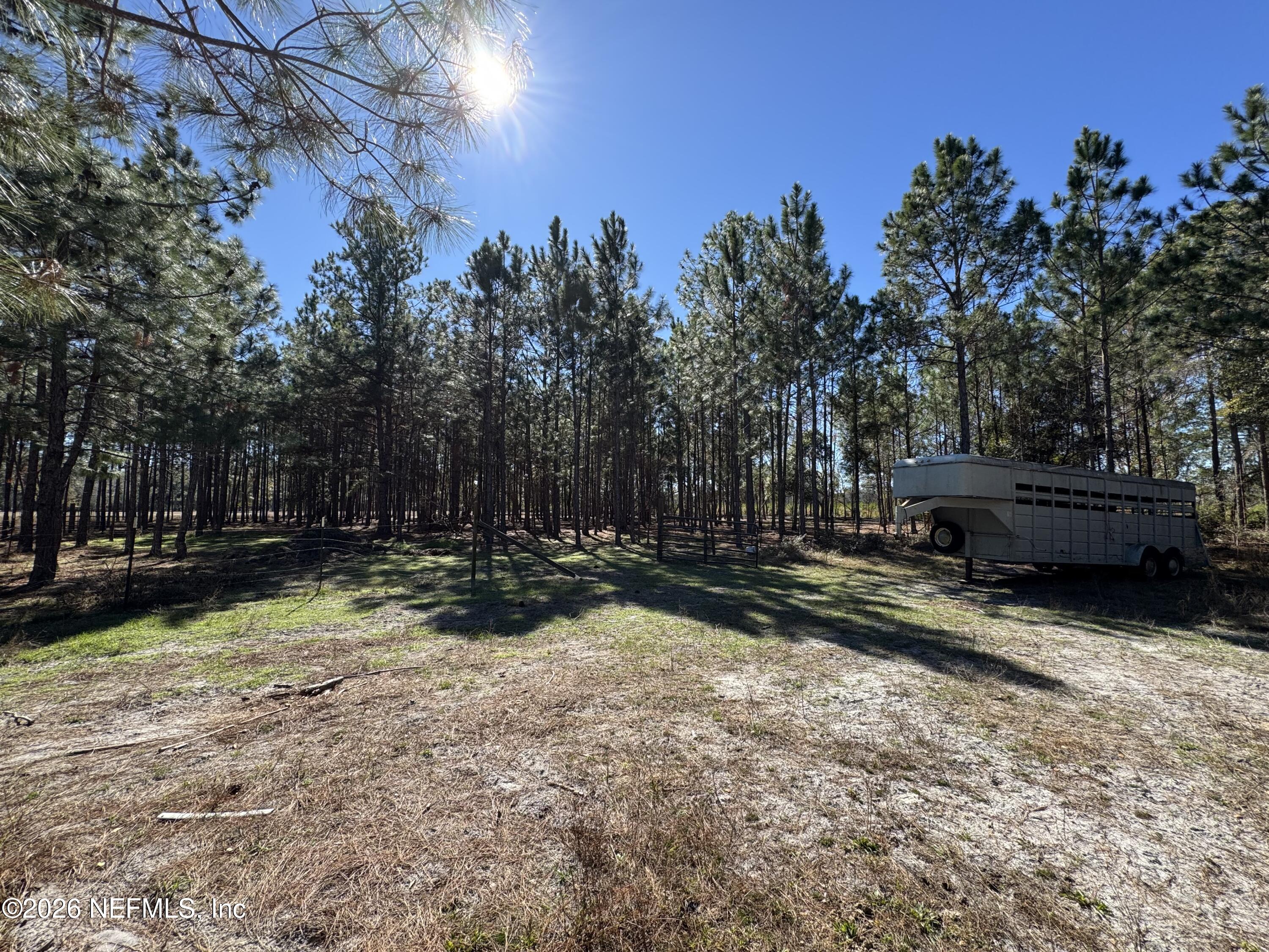 0 Southwest 105th Street Brooker, FL 32622 - Photo 31 of 40 a view of a yard with wooden fence