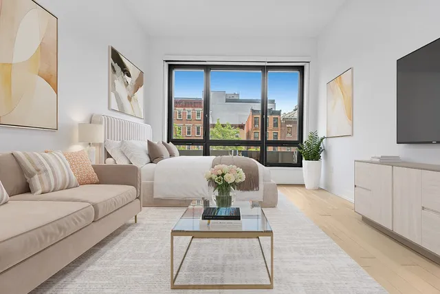 a living room with furniture fireplace and flat screen tv