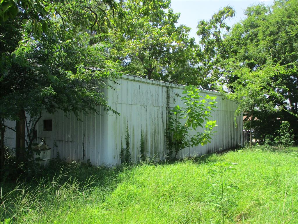 Tbd Wood Street Emory, TX 75440 - Photo 6 of 9 a view of backyard with potted plants and large tree