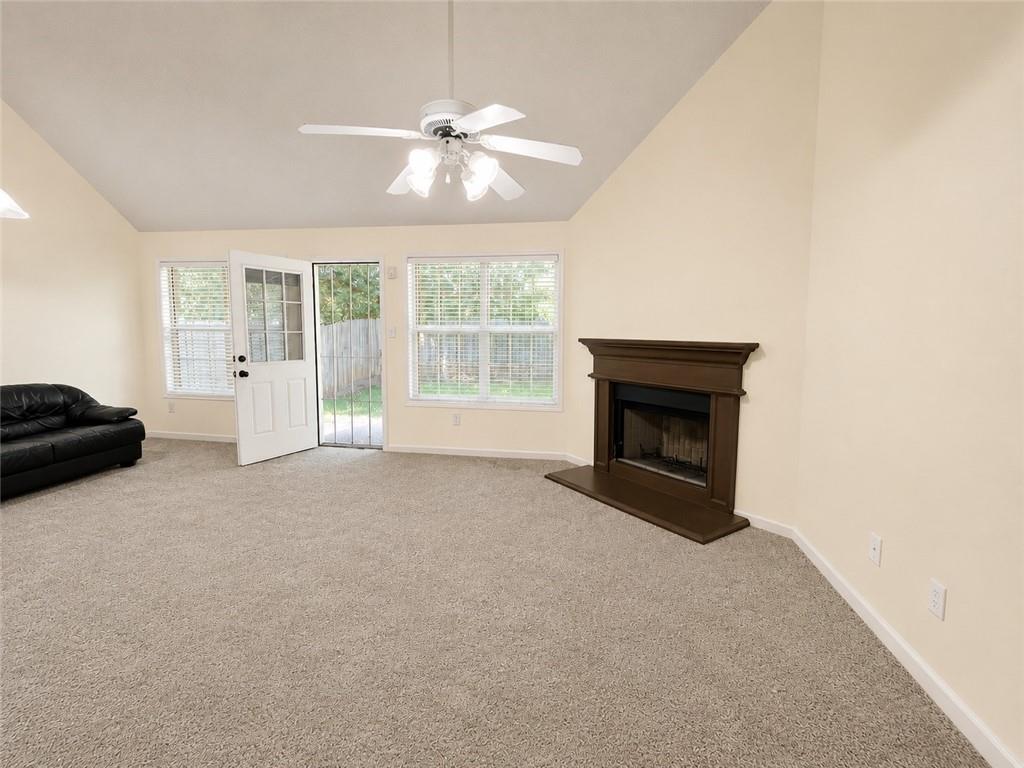 6936 Red Bone Way Stonecrest, GA 30038 - Photo 6 of 17 a view of empty room with a fireplace