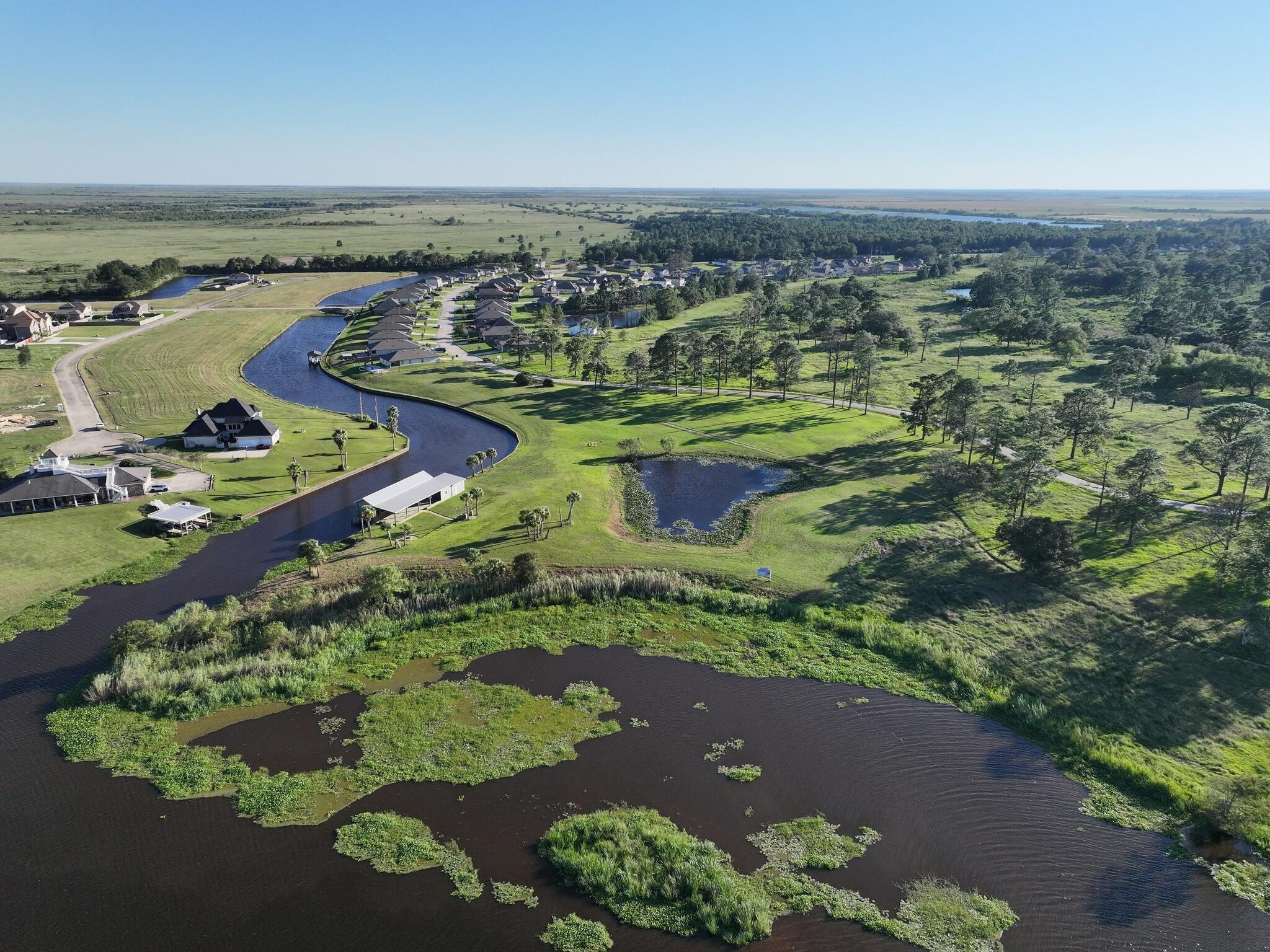 1315 Alice Lane Beaumont, TX 77705 - Photo 11 of 14 a view of a lake with a mountain in the background