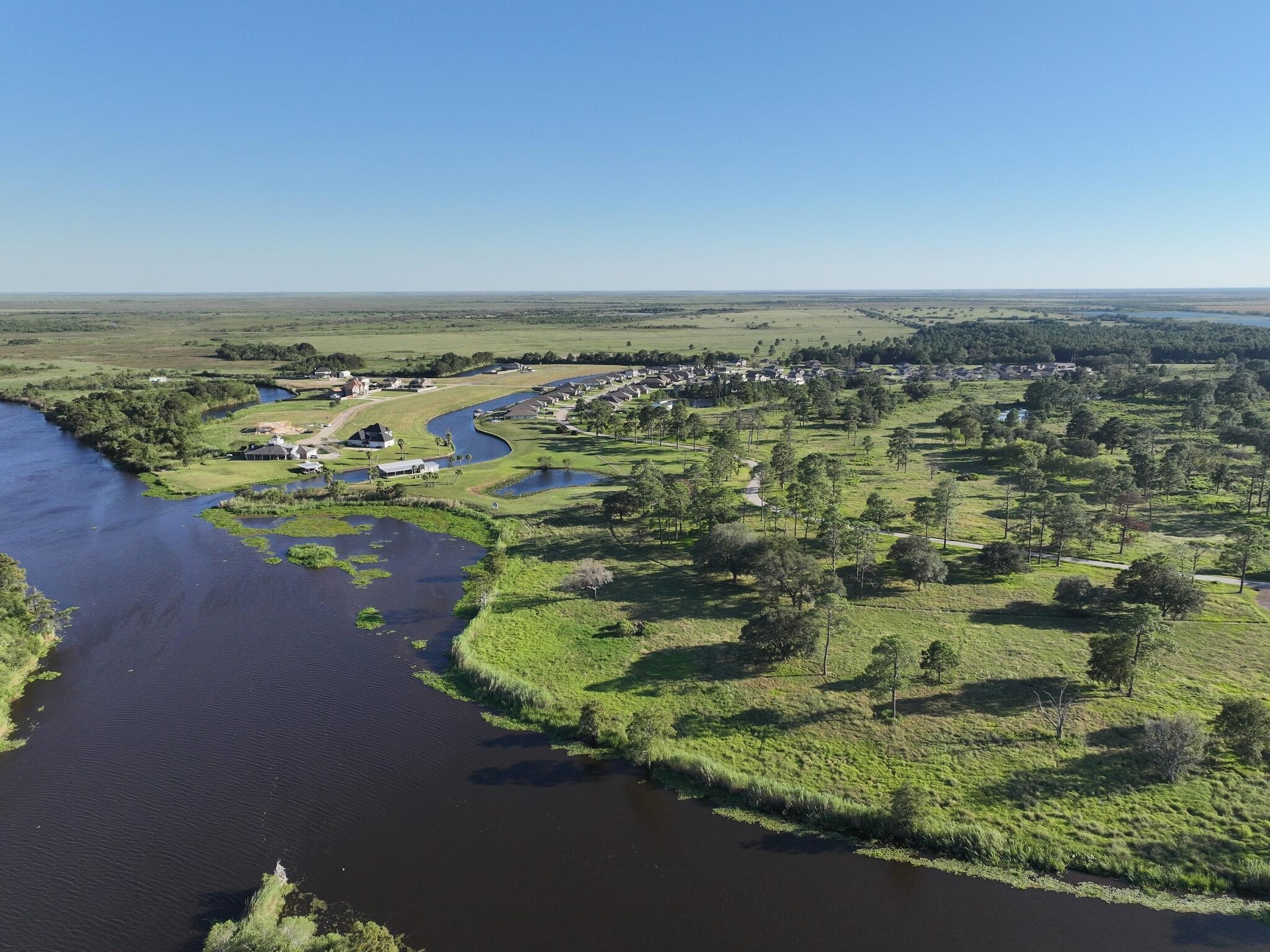 1315 Alice Lane Beaumont, TX 77705 - Photo 3 of 14 an aerial view of a house with a lake view