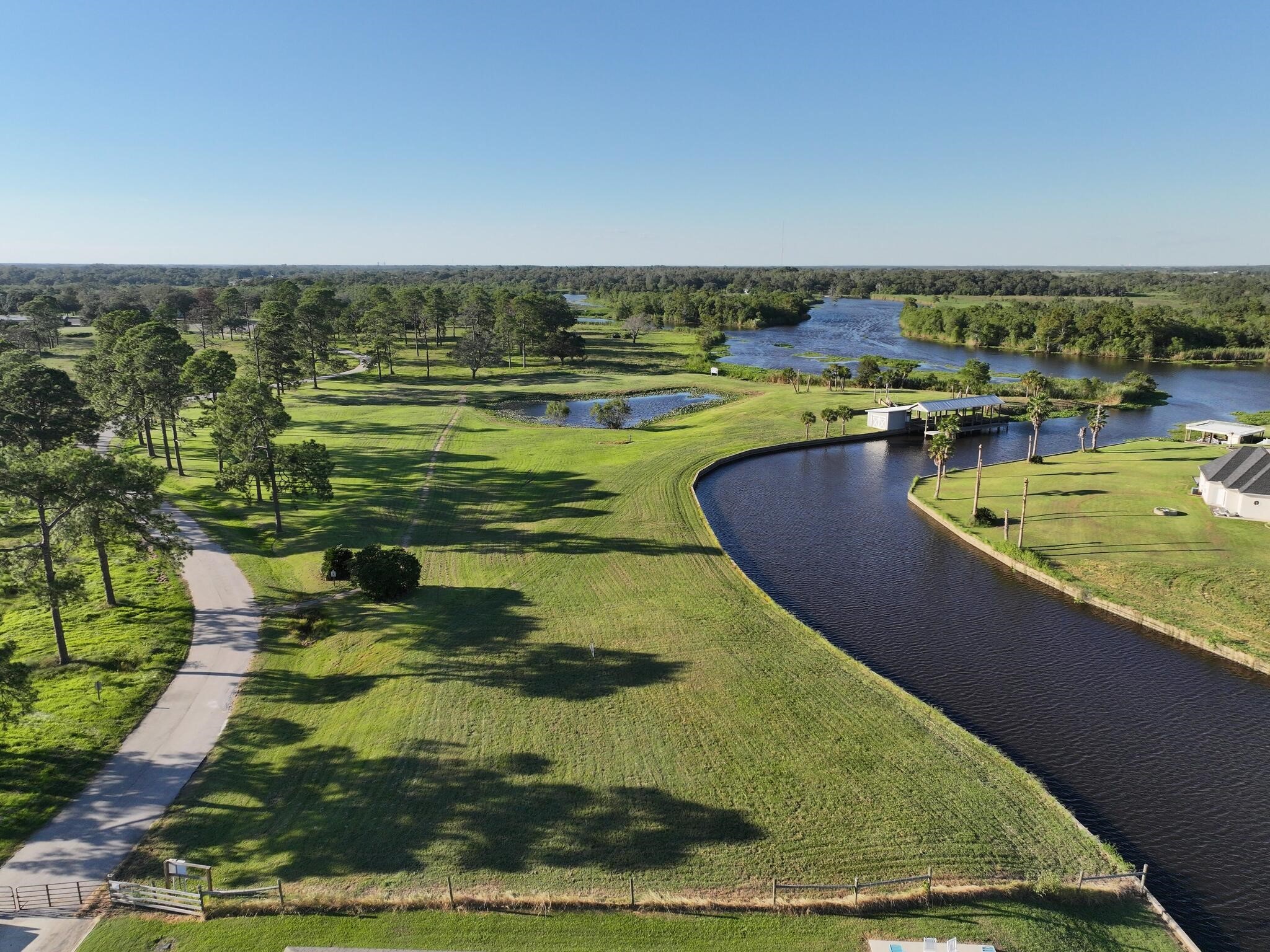 1315 Alice Lane Beaumont, TX 77705 - Photo 5 of 14 a view of a swimming pool with a lake