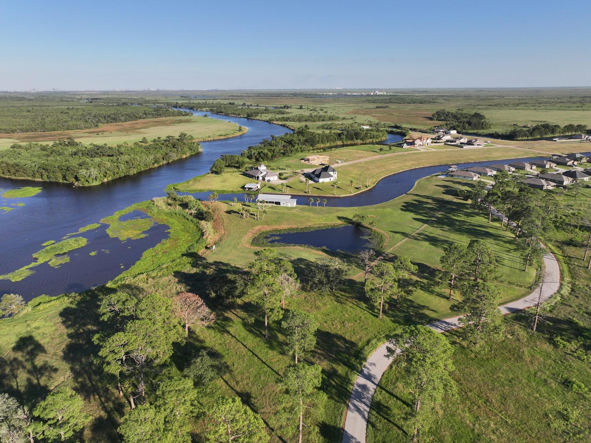 1315 Alice Lane Beaumont, TX 77705 - Photo 8 of 14 an aerial view of ocean and residential houses with outdoor space