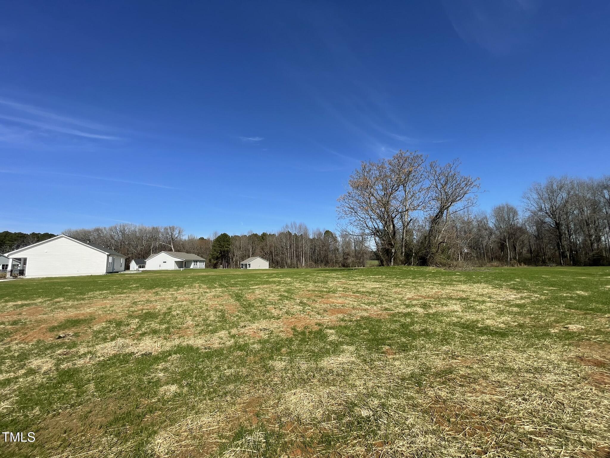 181 Pate Landing Drive Selma, NC 27576 - Photo 15 of 15 a view of an ocean and a yard