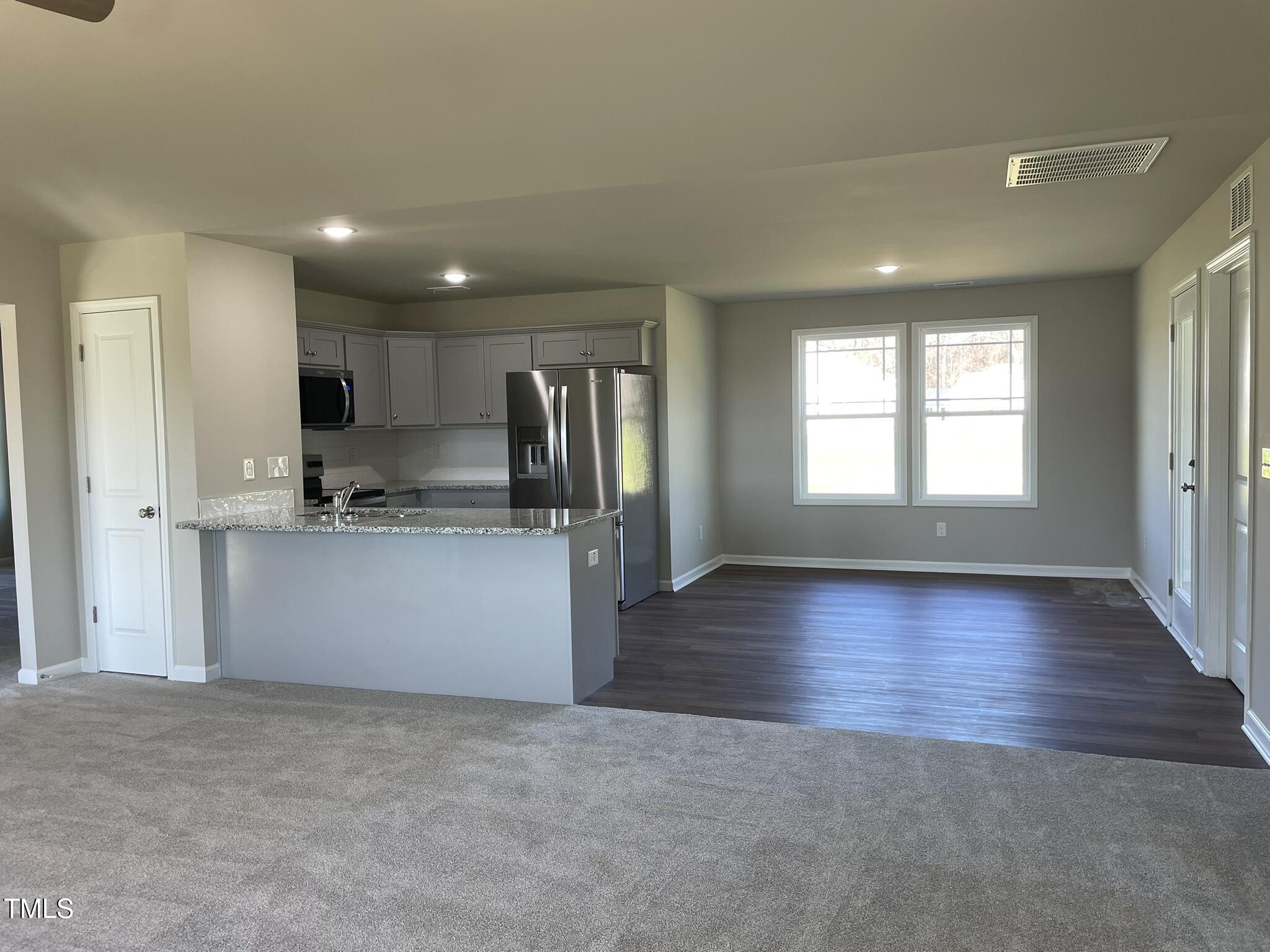 181 Pate Landing Drive Selma, NC 27576 - Photo 2 of 15 a view of kitchen with refrigerator and window