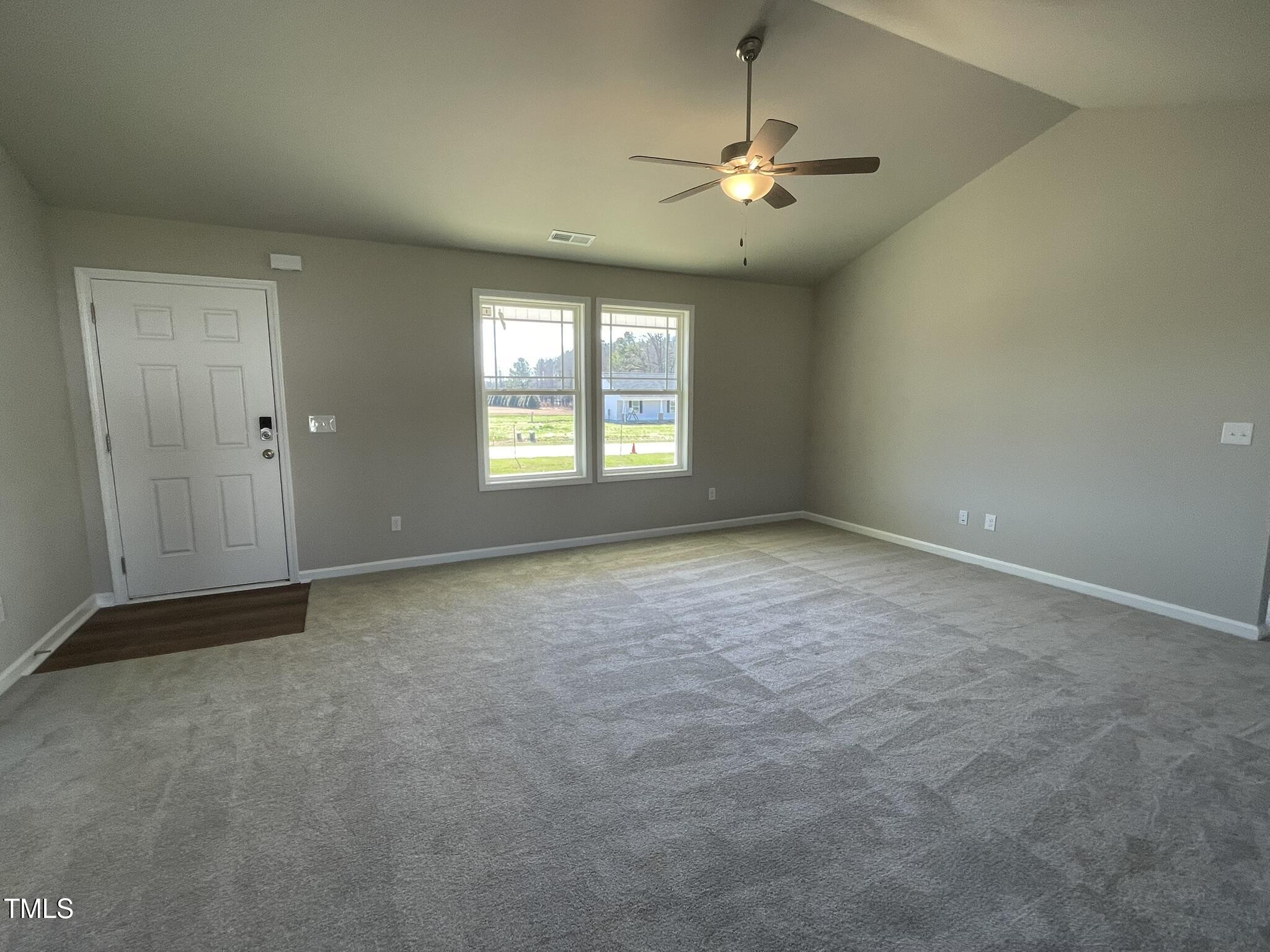 181 Pate Landing Drive Selma, NC 27576 - Photo 6 of 15 a view of an empty room with a window