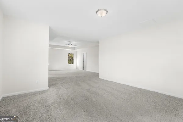 a view of empty room with windows