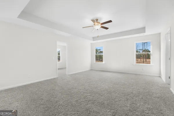 a view of an empty room with a window