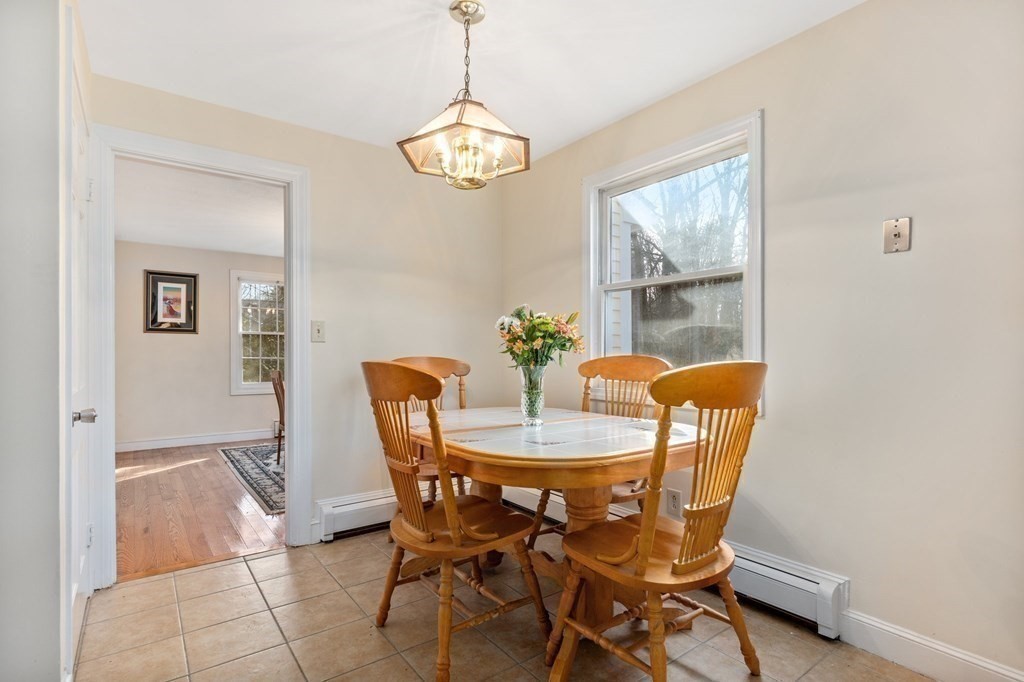 30 Woodside Road Topsfield, MA 01983 - Photo 15 of 42 a view of a dining room with furniture and chandelier
