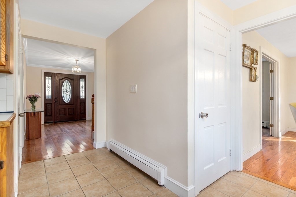 30 Woodside Road Topsfield, MA 01983 - Photo 16 of 42 a view of a hallway with wooden floor and cabinet