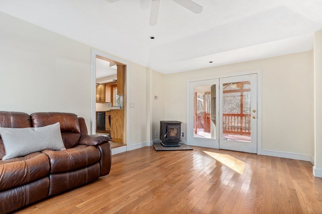 30 Woodside Road Topsfield, MA 01983 - Photo 17 of 42 a living room with furniture and a flat screen tv