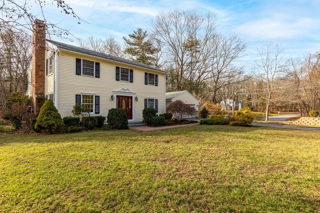30 Woodside Road Topsfield, MA 01983 - Photo 2 of 42 a front view of a house with a yard