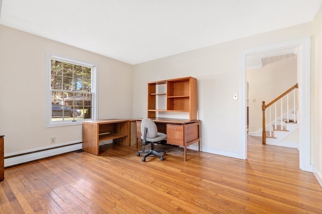 30 Woodside Road Topsfield, MA 01983 - Photo 22 of 42 a view of a workspace with furniture and a window