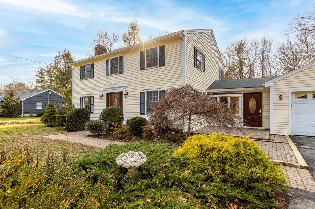 30 Woodside Road Topsfield, MA 01983 - Photo 3 of 42 a front view of a house with garden