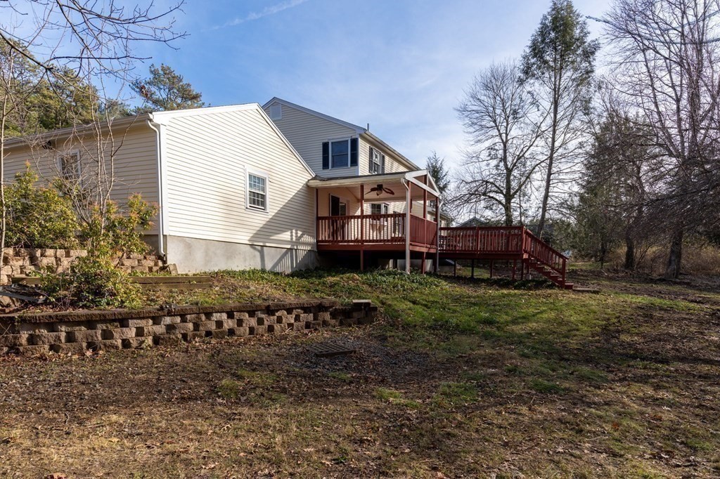 30 Woodside Road Topsfield, MA 01983 - Photo 40 of 42 a front view of a house with a yard