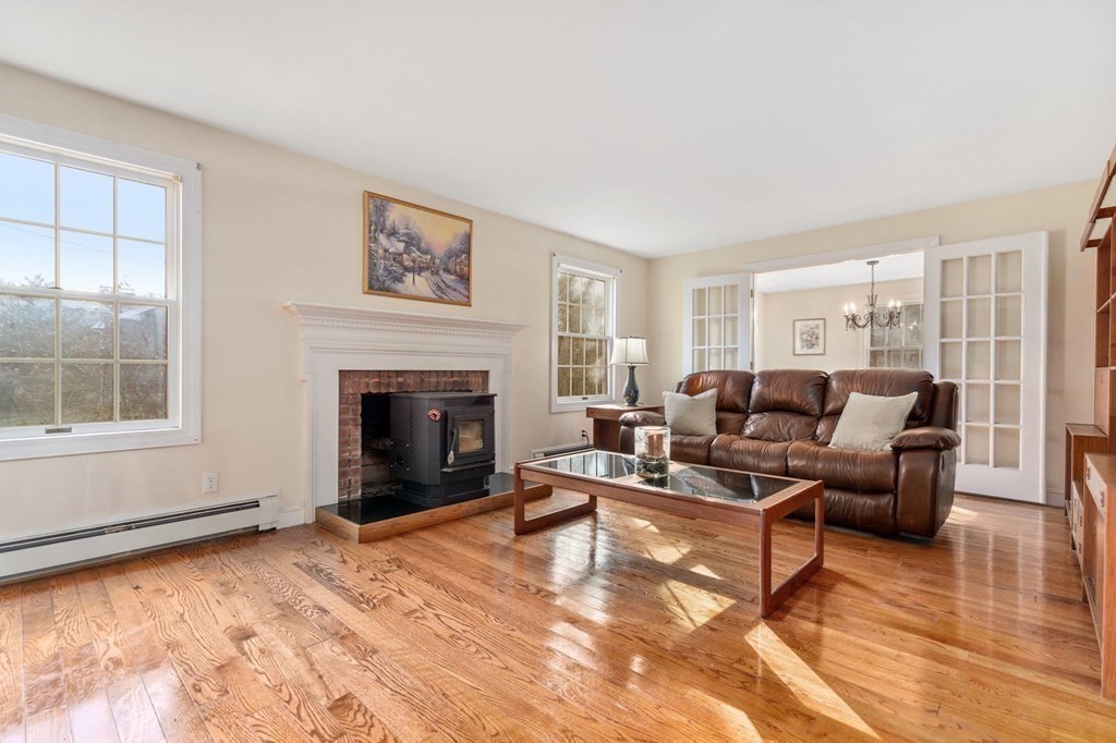 30 Woodside Road Topsfield, MA 01983 - Photo 5 of 42 a living room with furniture window and a fireplace