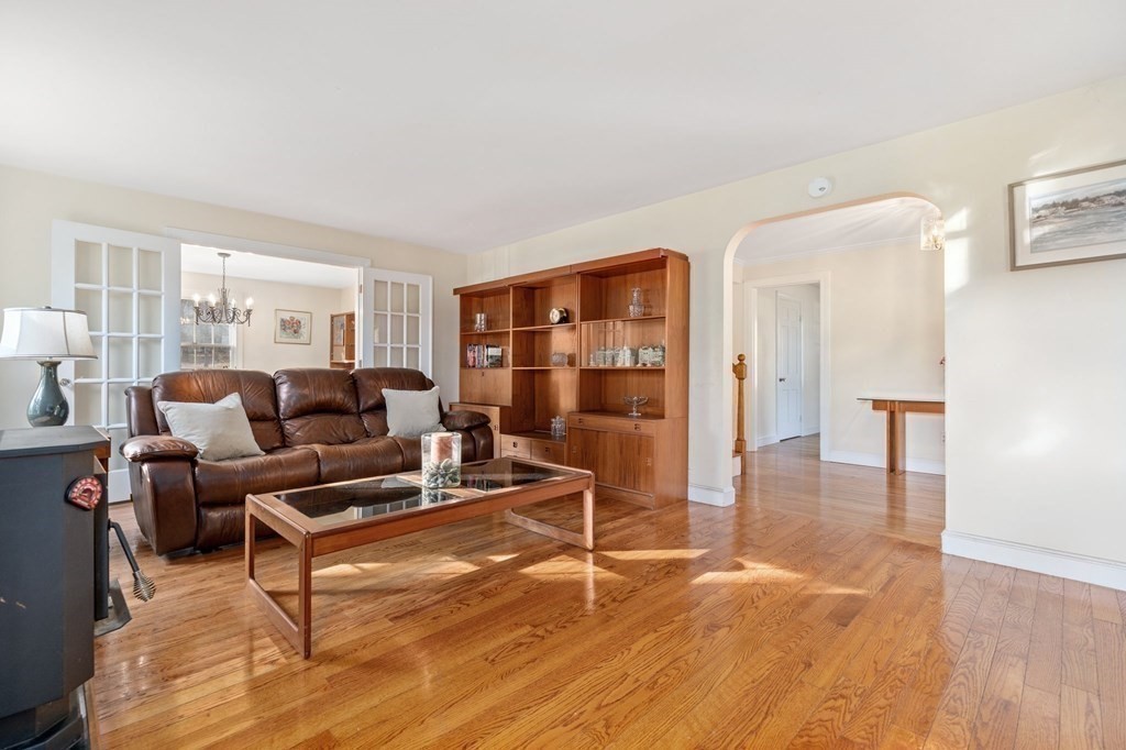 30 Woodside Road Topsfield, MA 01983 - Photo 6 of 42 a living room with furniture a lamp and wooden floor