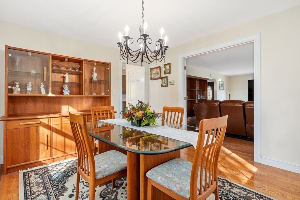 30 Woodside Road Topsfield, MA 01983 - Photo 10 of 42 a view of a dining room with furniture and chandelier