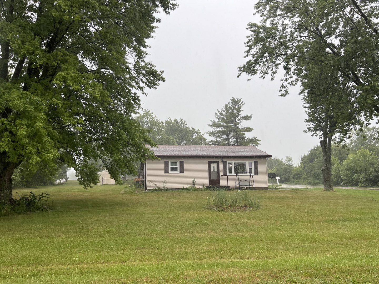 211 Hickory Drive Roberts, IL 60962 - Photo 9 of 14 a house view with swimming pool and trees in the background