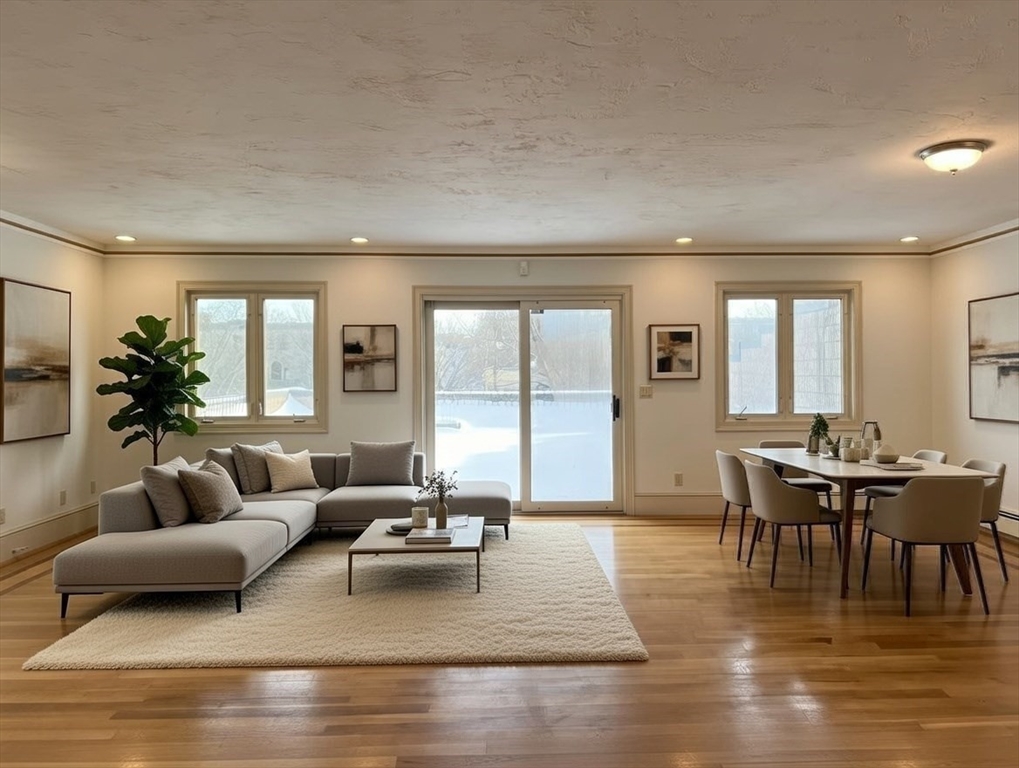 1002 Beacon Street Brookline, MA 02446 - Photo 11 of 17 a living room with furniture and a large window