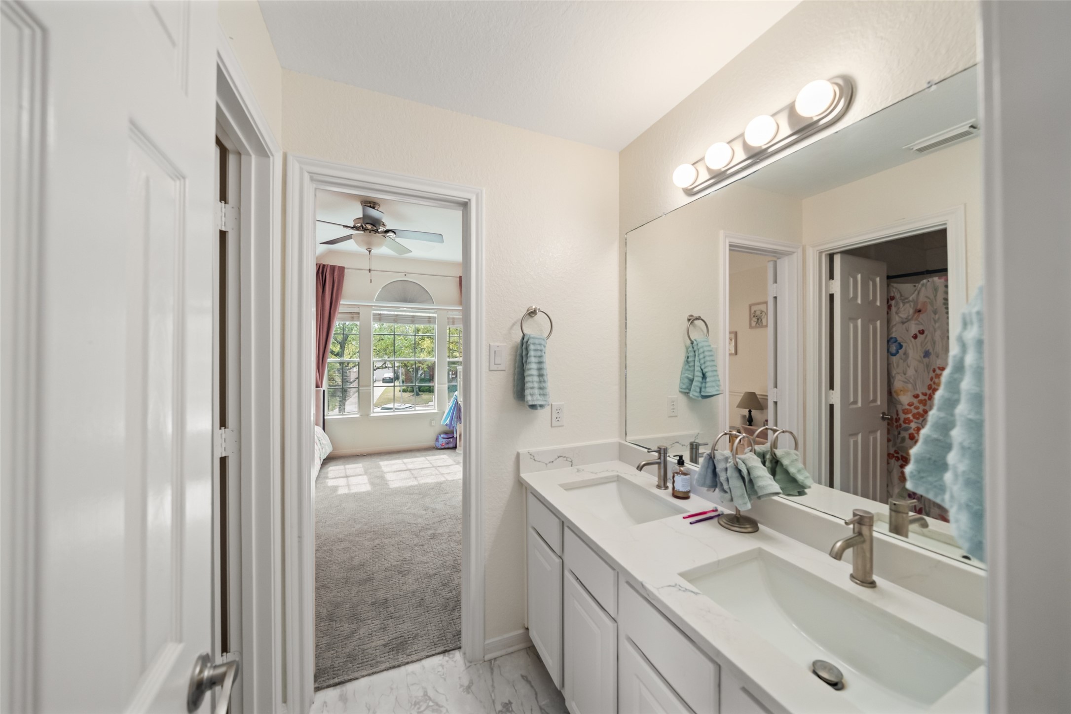 6010 Foxland Court Spring, TX 77379 - Photo 25 of 43 This full bathroom is shared by bedroom two & three.