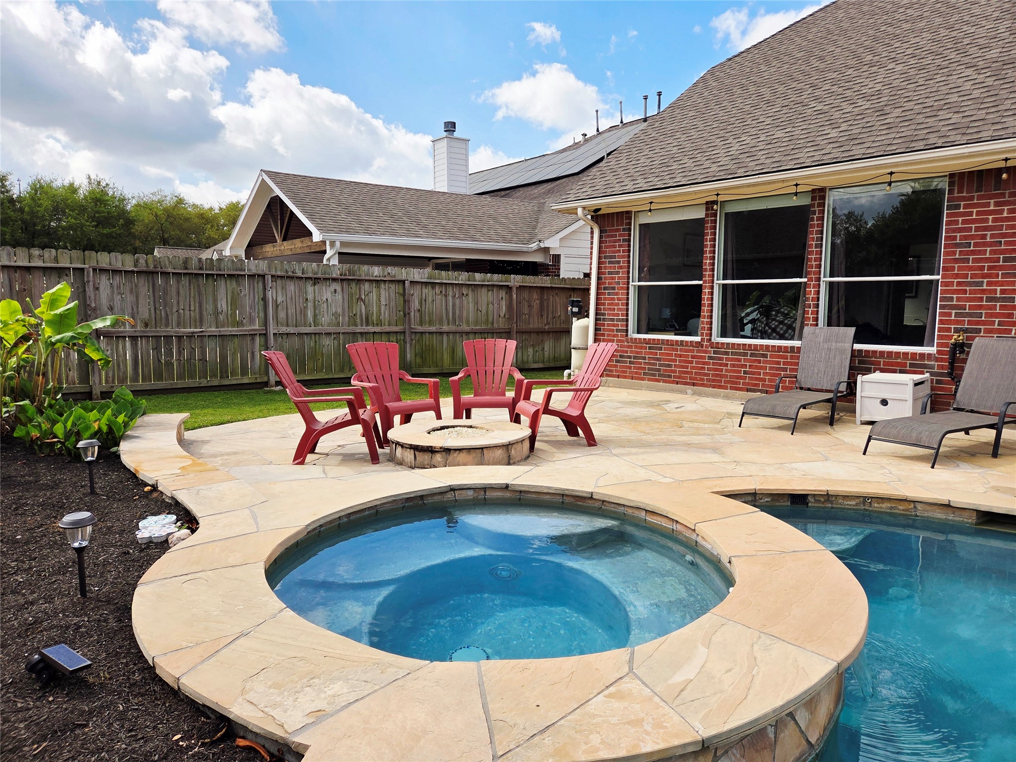 6010 Foxland Court Spring, TX 77379 - Photo 31 of 43 The home boasts a built-in hot tub and a fire pit for gatherings.